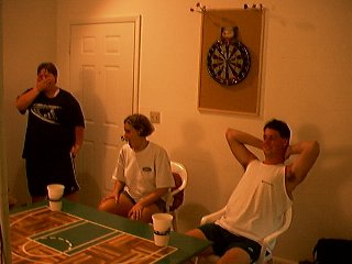 Adam's laughing at somthing, probably having to do with the chick in the middle. I'm still not sure what her real name was